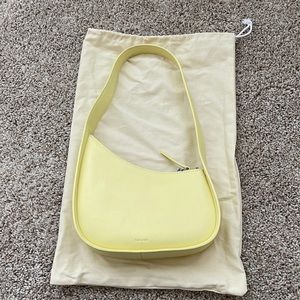 The row Half Moon Bag in Leather yellow